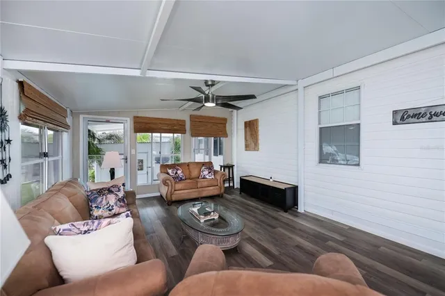 a living room with furniture and a walk in closet