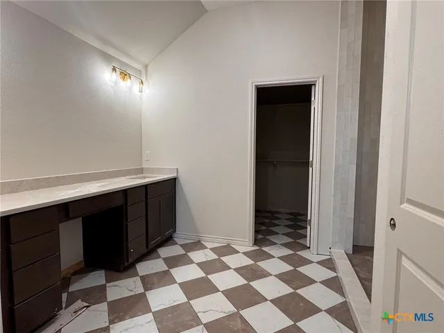 a room with a black white checkered floor