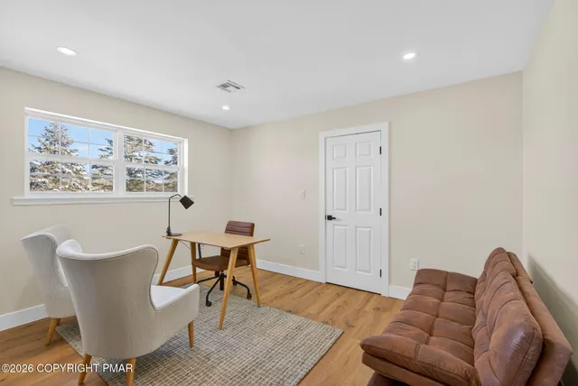 a living room with furniture and a window