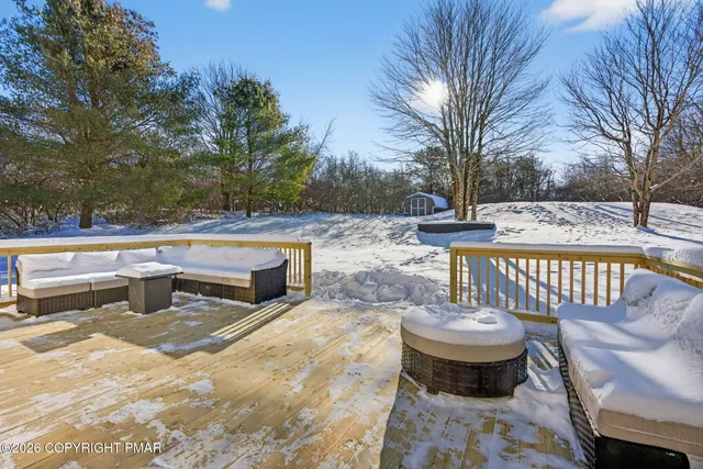 a view of a patio with iron fence