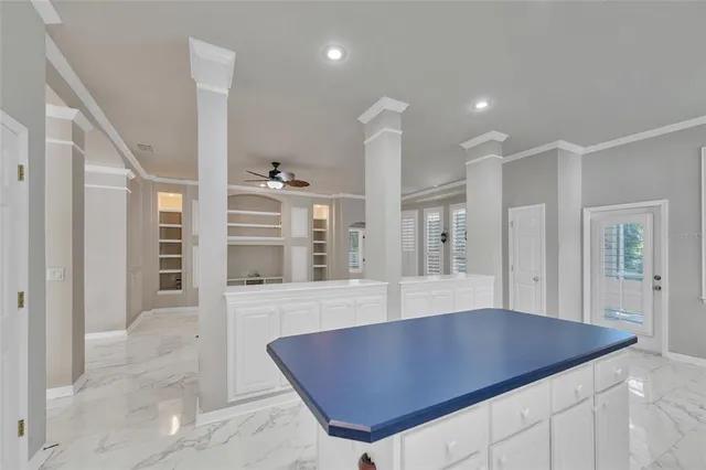 a kitchen with a refrigerator a sink and cabinets