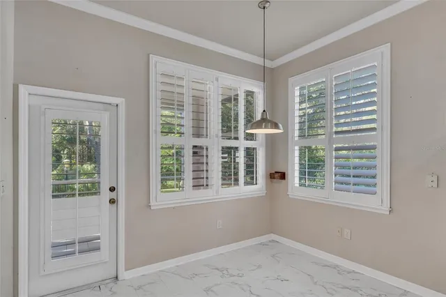 a view of a porch with wooden floor and fence