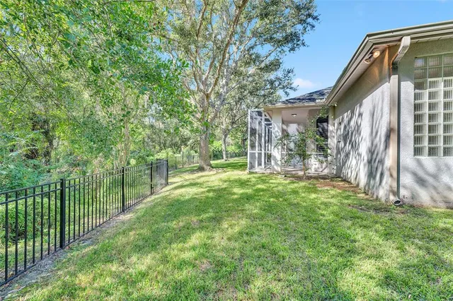 a front view of multiple houses with yard swimming pool and outdoor seating