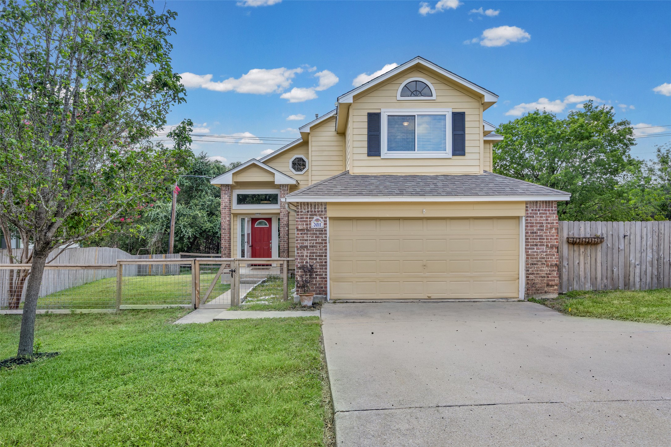 3011 Wadsworth Way Austin, TX 78748 - Photo 2 of 35 A welcoming front exterior with a fenced yard and brick accents, presenting a delightful curb appeal.