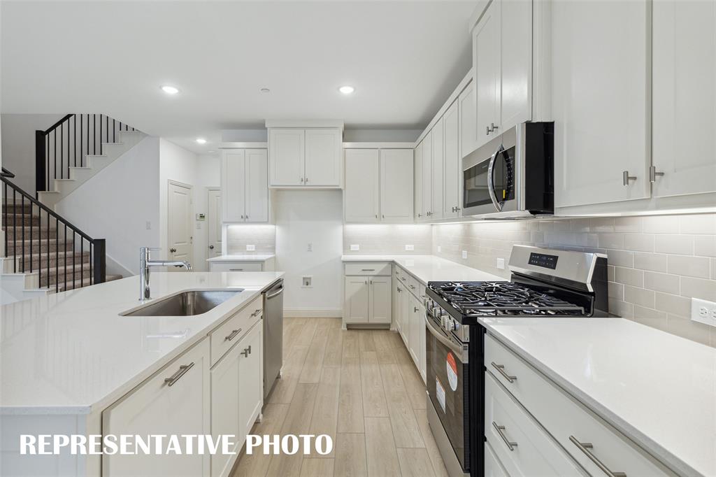 1015 Magdalena Way Midlothian, TX 76065 - Photo 14 of 16 Our Emily floor plan offers a kitchen any chef would be proud to call their own! REPRESENTATIVE PHOTO