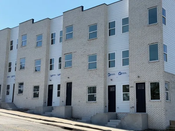 a front view of a building with multiple windows