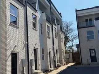 a view of a building with a tree