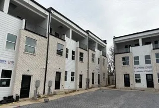 a front view of a building with a street