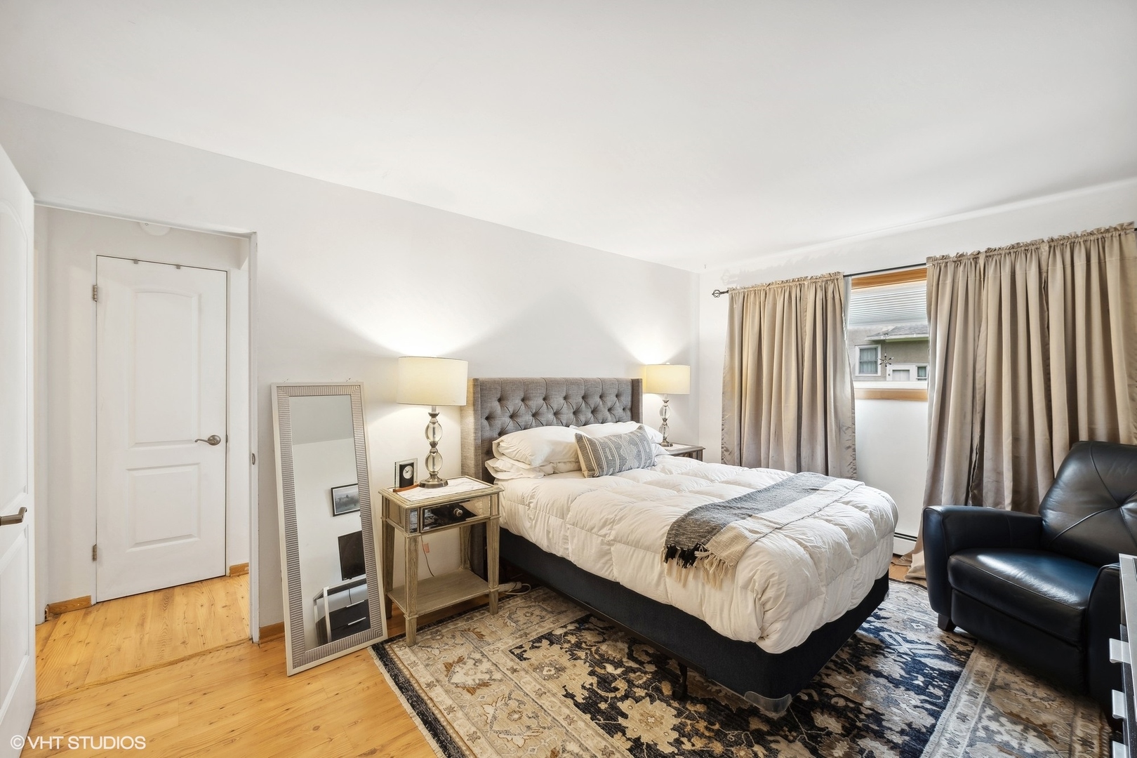 1127 West Erie Street, Unit 1C 1C Chicago, IL 60642 - Photo 14 of 18 a bedroom with a bed and a walk in closet