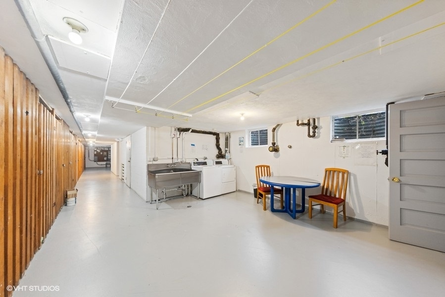 1127 West Erie Street, Unit 1C 1C Chicago, IL 60642 - Photo 17 of 18 a living room with furniture and a dining table with wooden floor