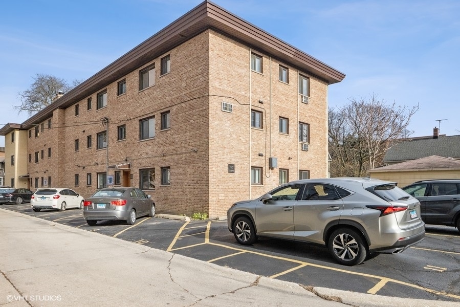 1127 West Erie Street, Unit 1C 1C Chicago, IL 60642 - Photo 18 of 18 a view of a car parked in front of a building