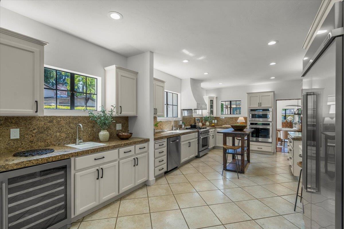 731 5th Street Gilroy, CA 95020 - Photo 11 of 30 a kitchen with lots of counter top space and appliances