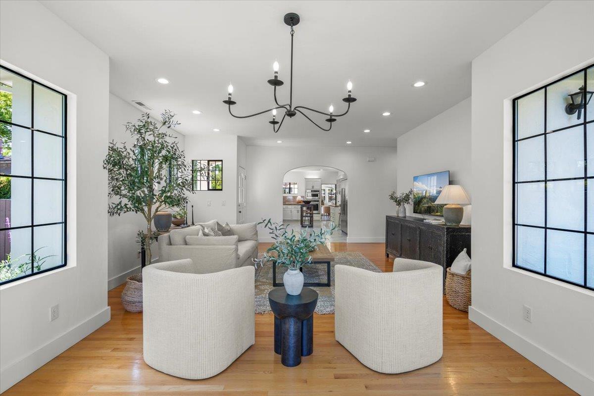 731 5th Street Gilroy, CA 95020 - Photo 13 of 30 a living room with fireplace furniture and a chandelier