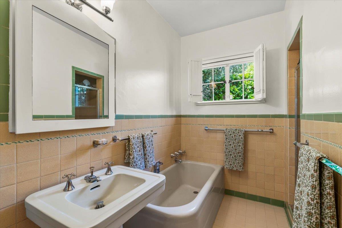 731 5th Street Gilroy, CA 95020 - Photo 23 of 30 a bathroom with a sink and a mirror