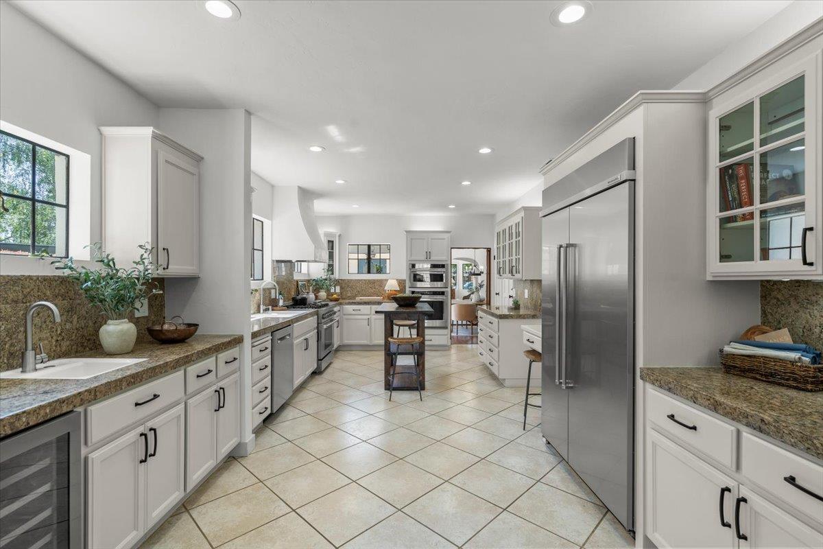731 5th Street Gilroy, CA 95020 - Photo 10 of 30 a kitchen with counter top space cabinets and stainless steel appliances