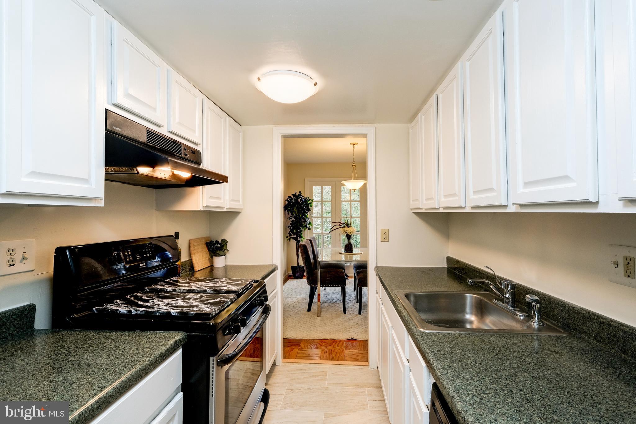 1905 Lyttonsville Road Silver Spring, MD 20910 - Photo 6 of 30 White kitchen with ample storage and counter space