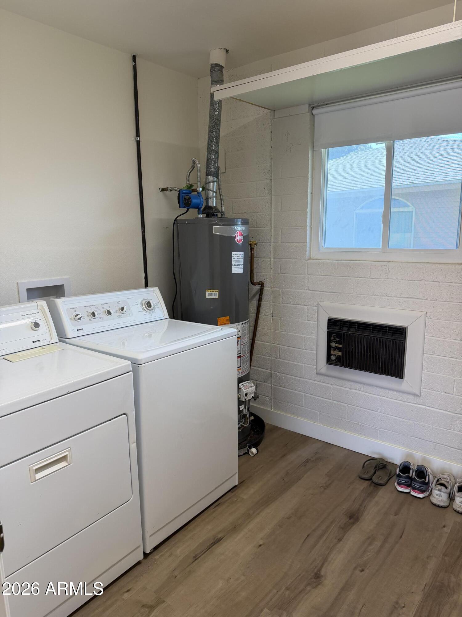 9936 West Mountain View Road Sun City, AZ 85351 - Photo 15 of 21 a utility room with dryer and washer