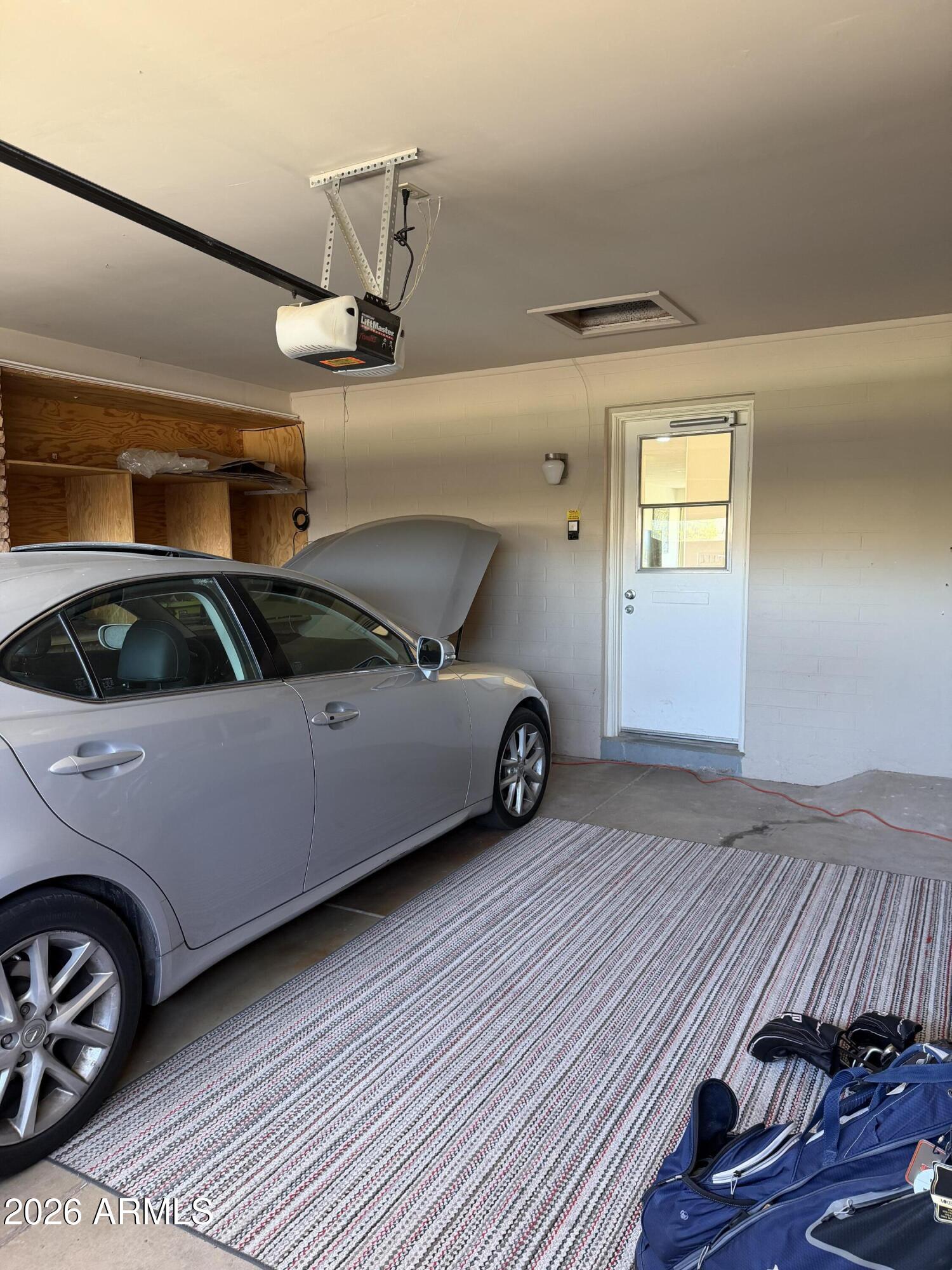 9936 West Mountain View Road Sun City, AZ 85351 - Photo 18 of 21 a view of a car in garage