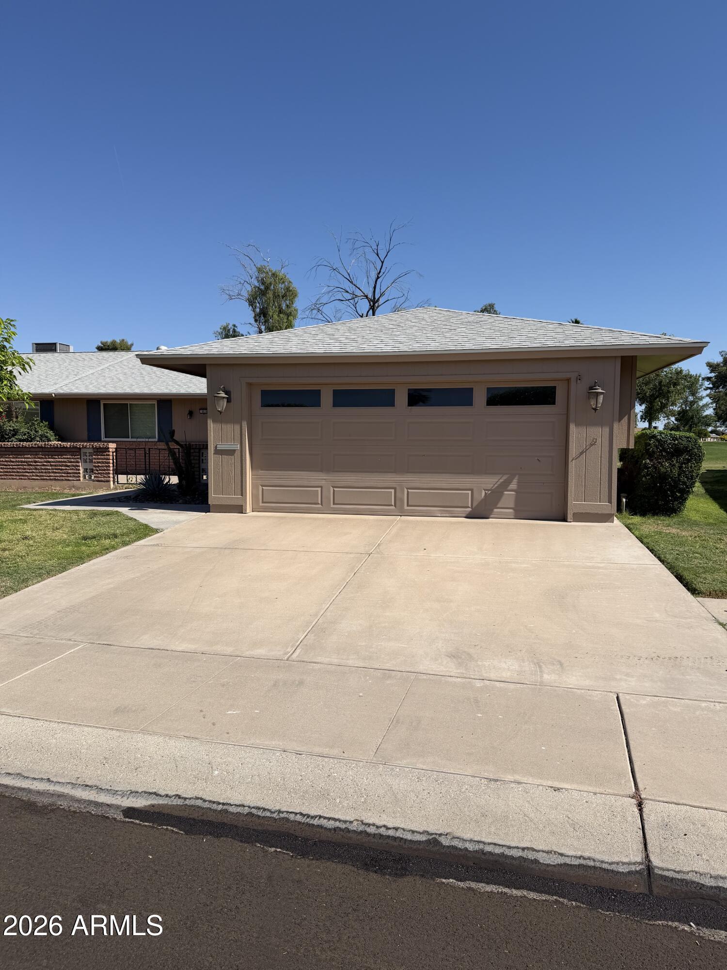 9936 West Mountain View Road Sun City, AZ 85351 - Photo 2 of 21 a view of a building with a yard