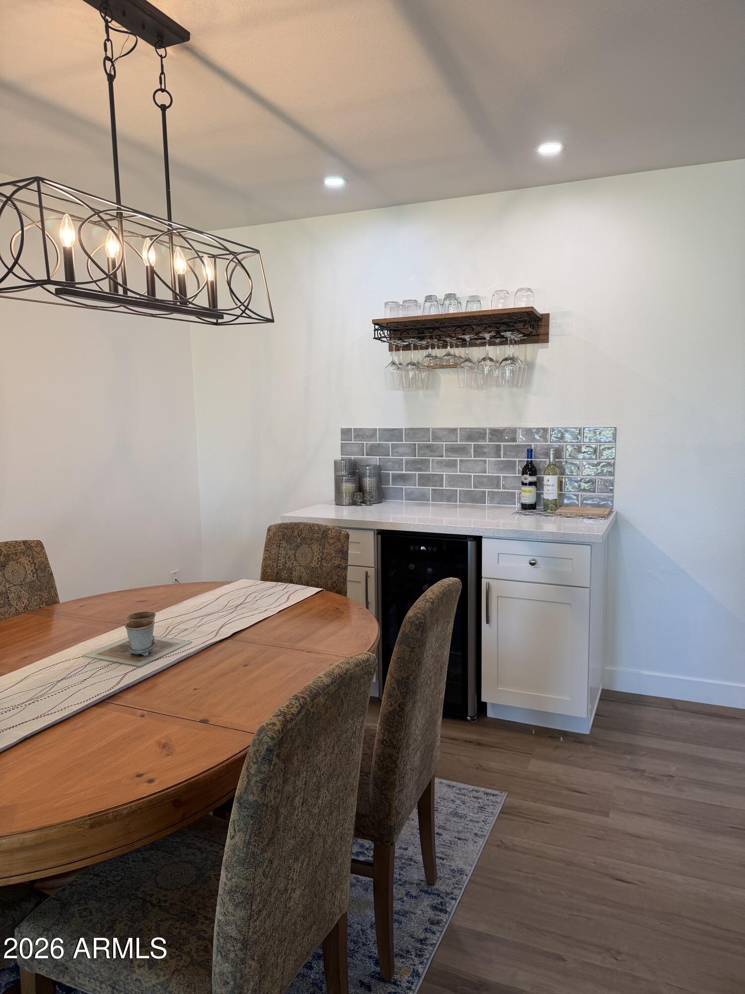 9936 West Mountain View Road Sun City, AZ 85351 - Photo 7 of 21 a bed room with a table and chairs