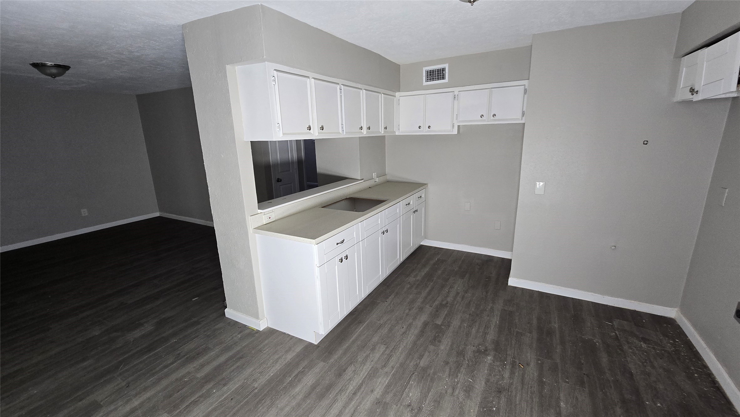 6723 South Loop E Freeway, Unit 9 Houston, TX 77087 - Photo 30 of 50 a kitchen with wooden floor and cabinets