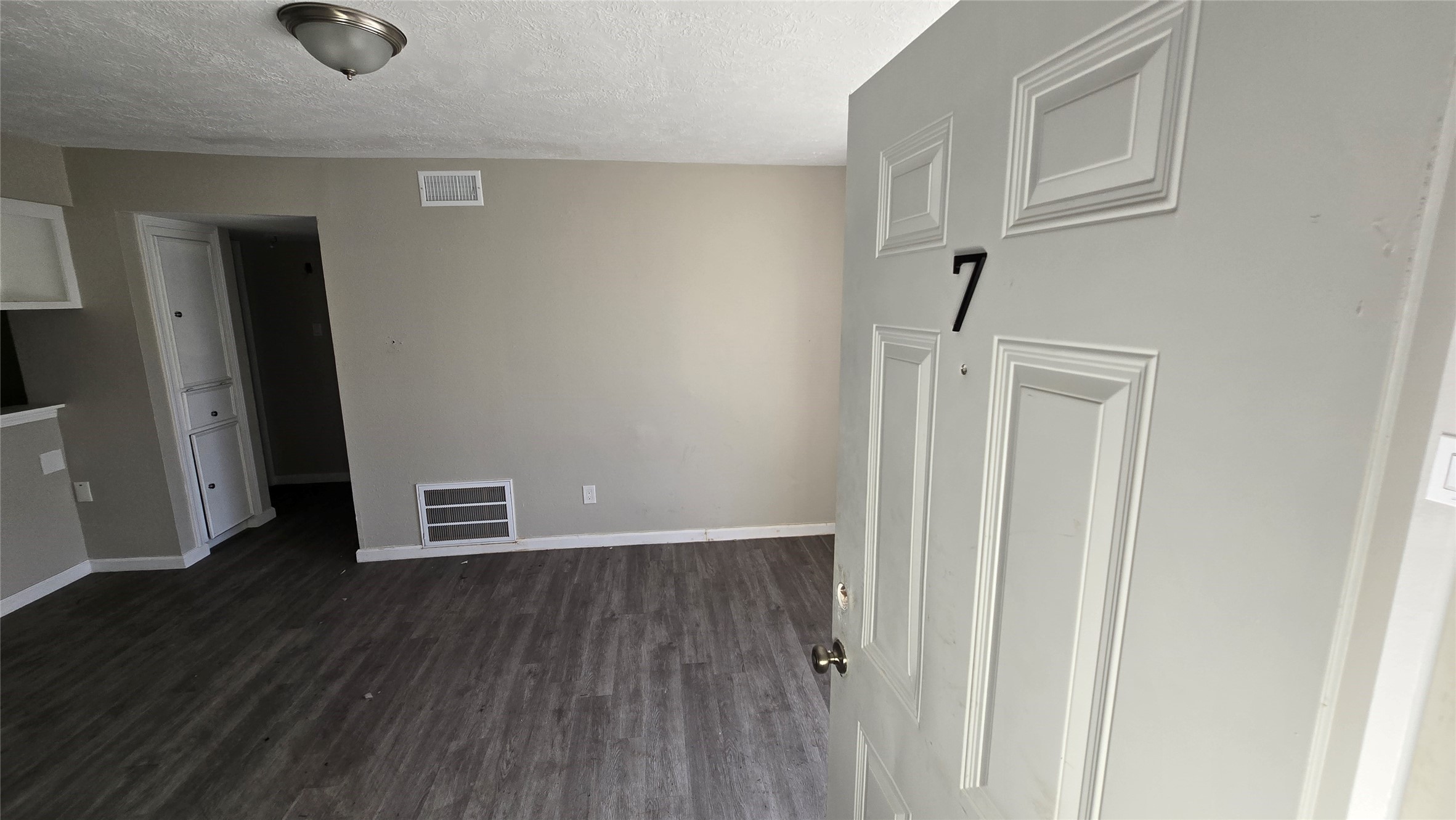 6723 South Loop E Freeway, Unit 9 Houston, TX 77087 - Photo 35 of 50 an empty room with wooden floor and windows