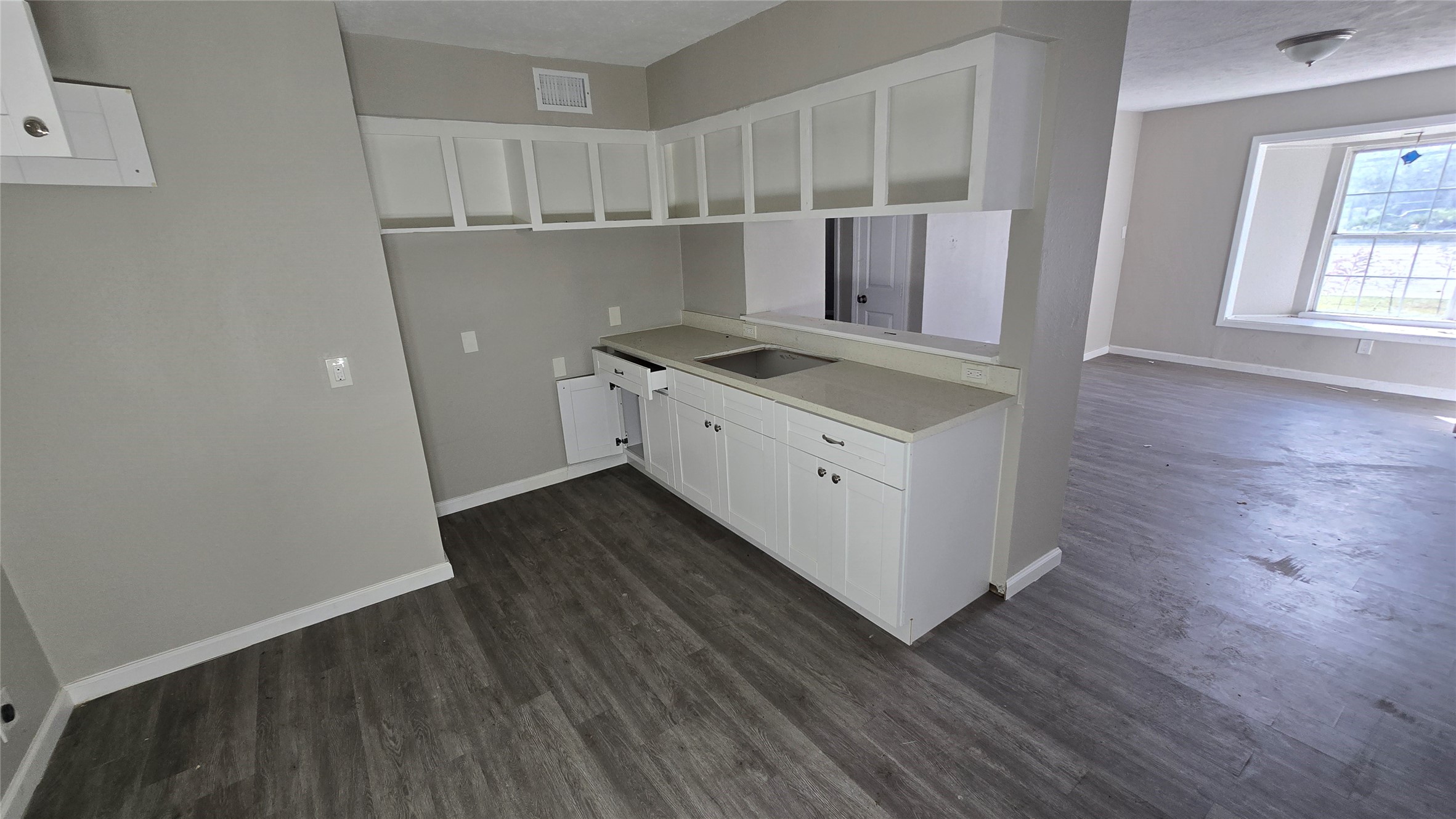 6723 South Loop E Freeway, Unit 9 Houston, TX 77087 - Photo 37 of 50 a kitchen with wooden cabinets and a sink