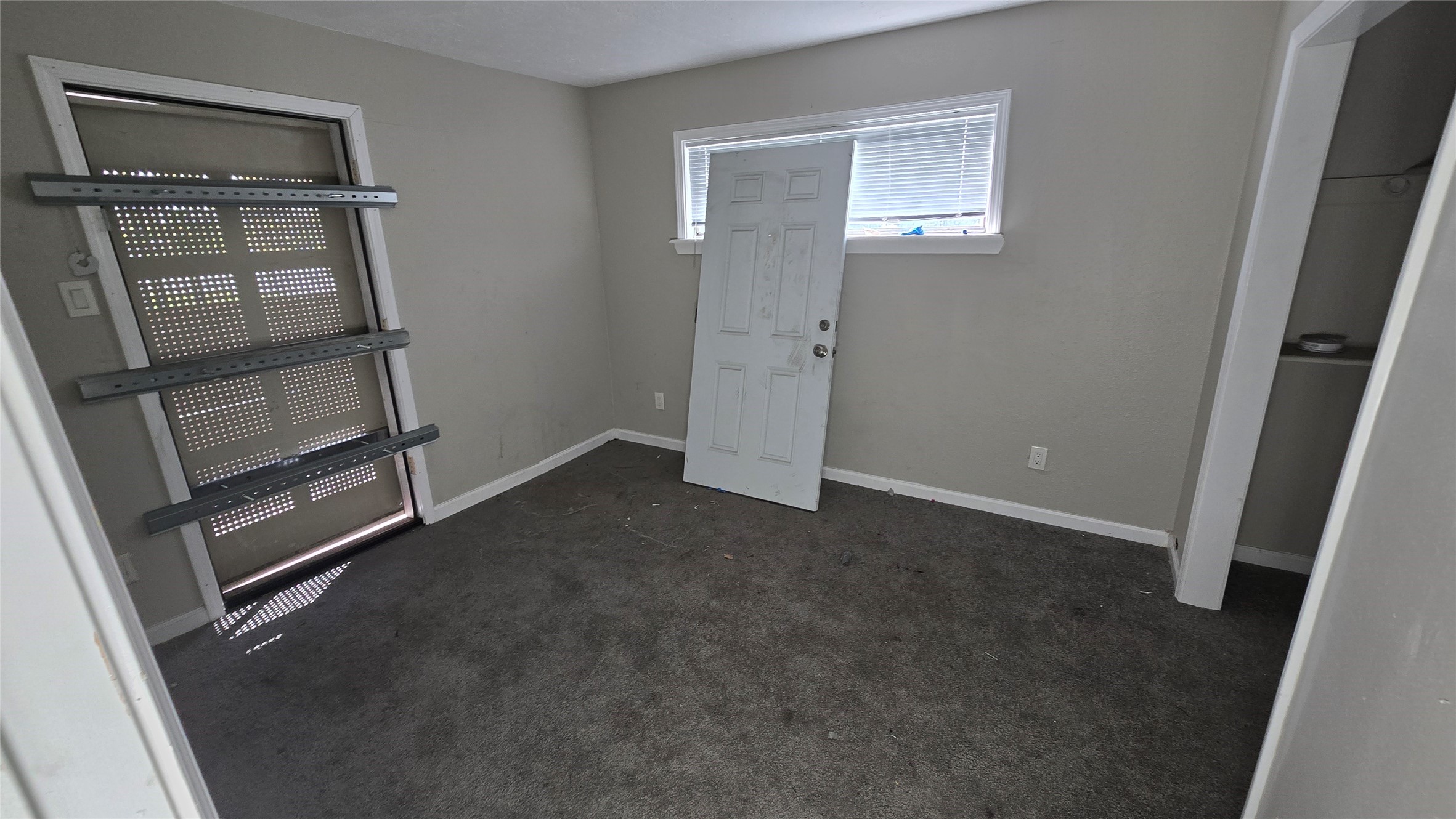 6723 South Loop E Freeway, Unit 9 Houston, TX 77087 - Photo 39 of 50 an empty room with wooden floor and windows