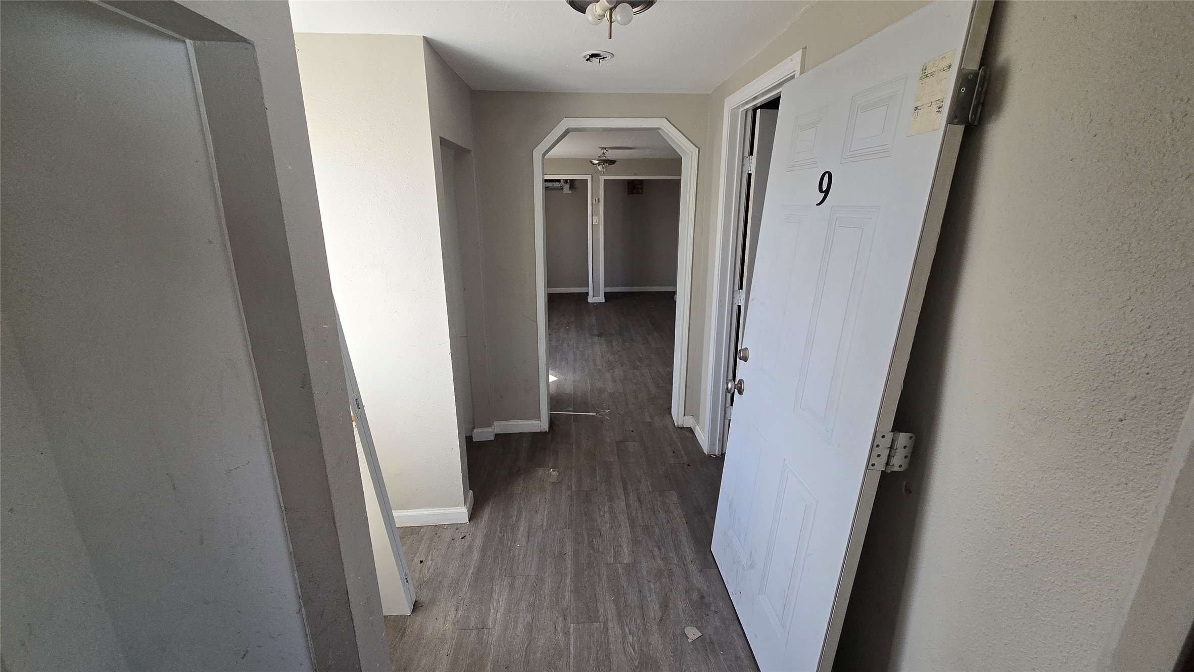 6723 South Loop E Freeway, Unit 9 Houston, TX 77087 - Photo 46 of 50 a view of a hallway with wooden floor and staircase