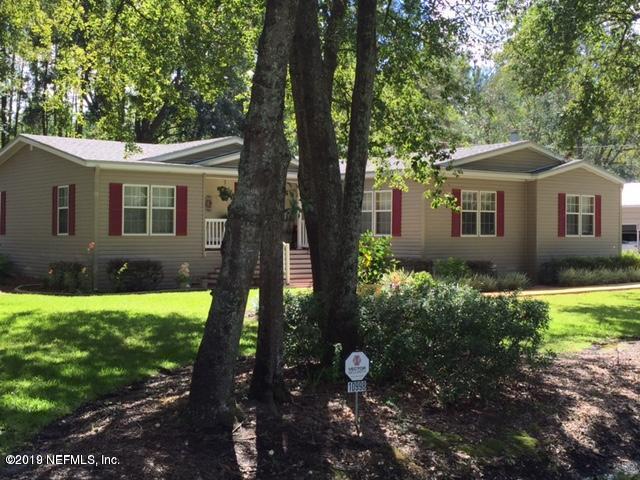 10998 Old Gainesville Road Jacksonville, FL 32221 - Photo 1 of 1 a front view of a house with garden