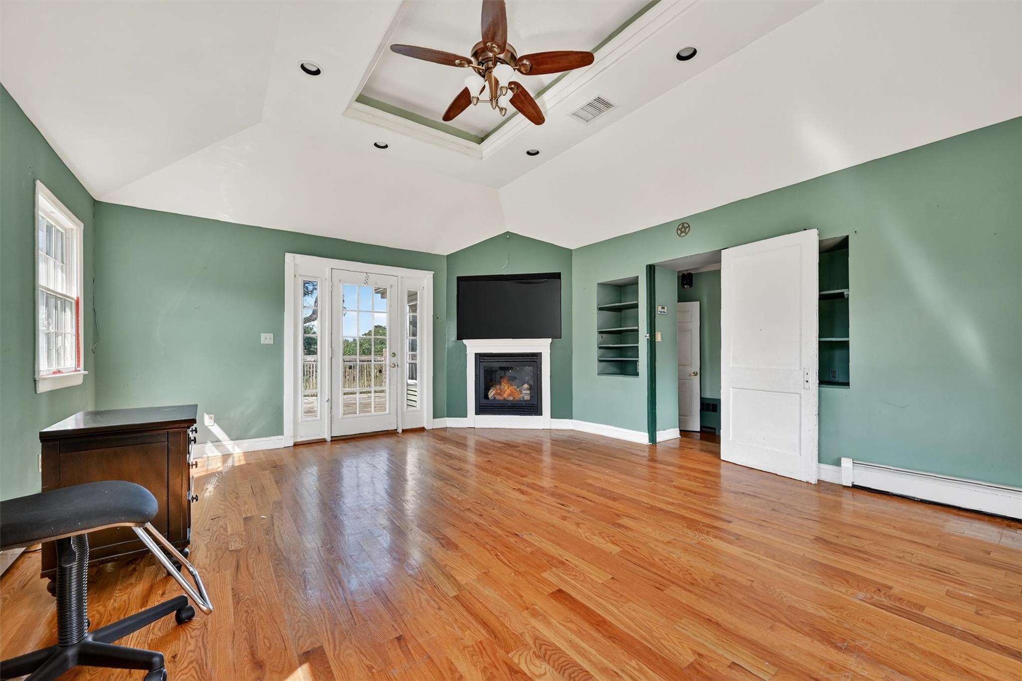 151 Tuthill Road Blooming Grove, NY 10914 - Photo 15 of 49 a view of an empty room with window and wooden floor