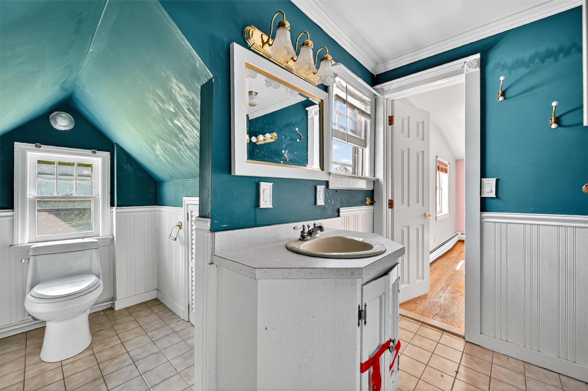 151 Tuthill Road Blooming Grove, NY 10914 - Photo 20 of 49 a bathroom with a sink a toilet and a mirror