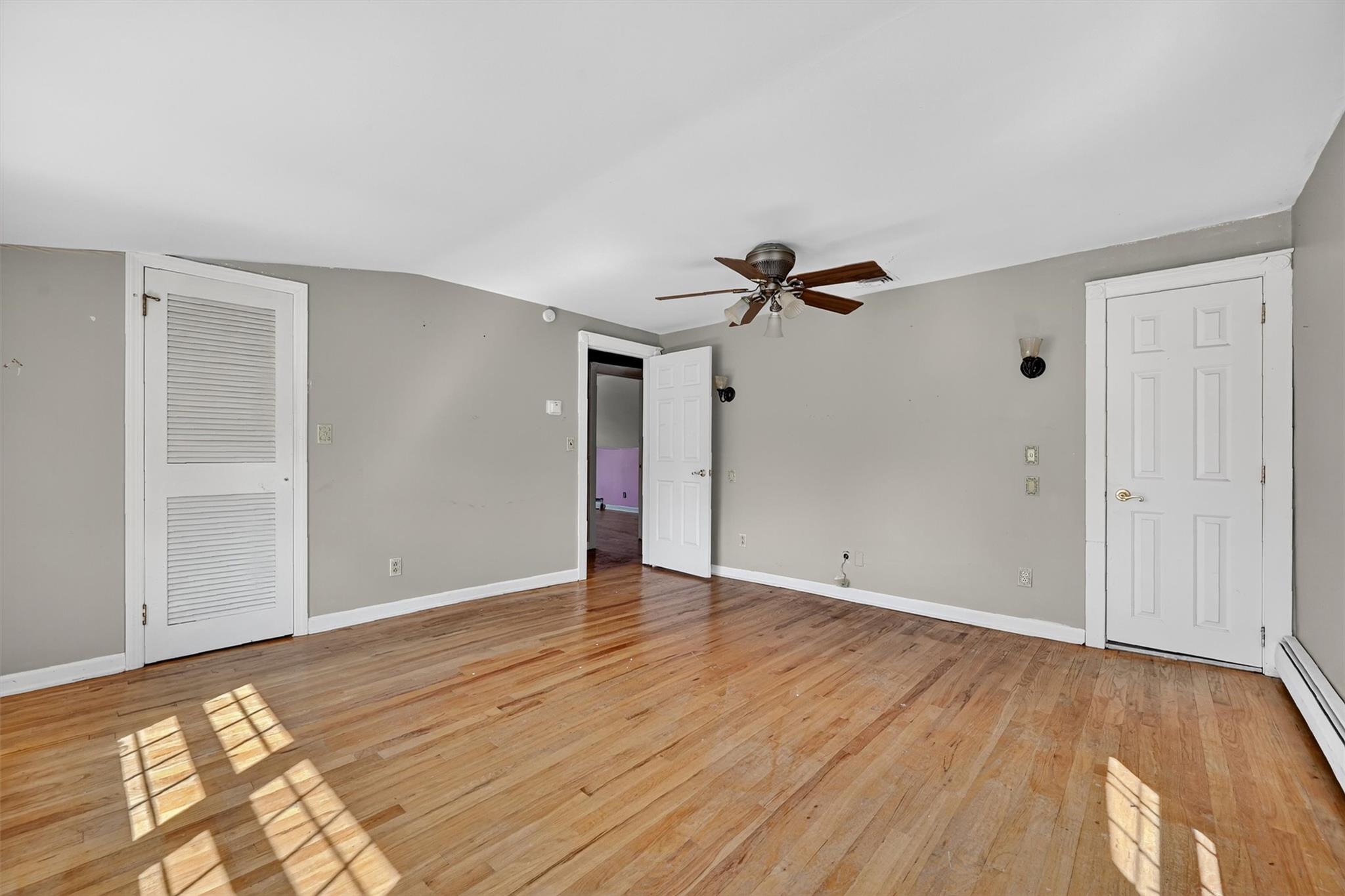 151 Tuthill Road Blooming Grove, NY 10914 - Photo 23 of 49 a view of an empty room with wooden floor
