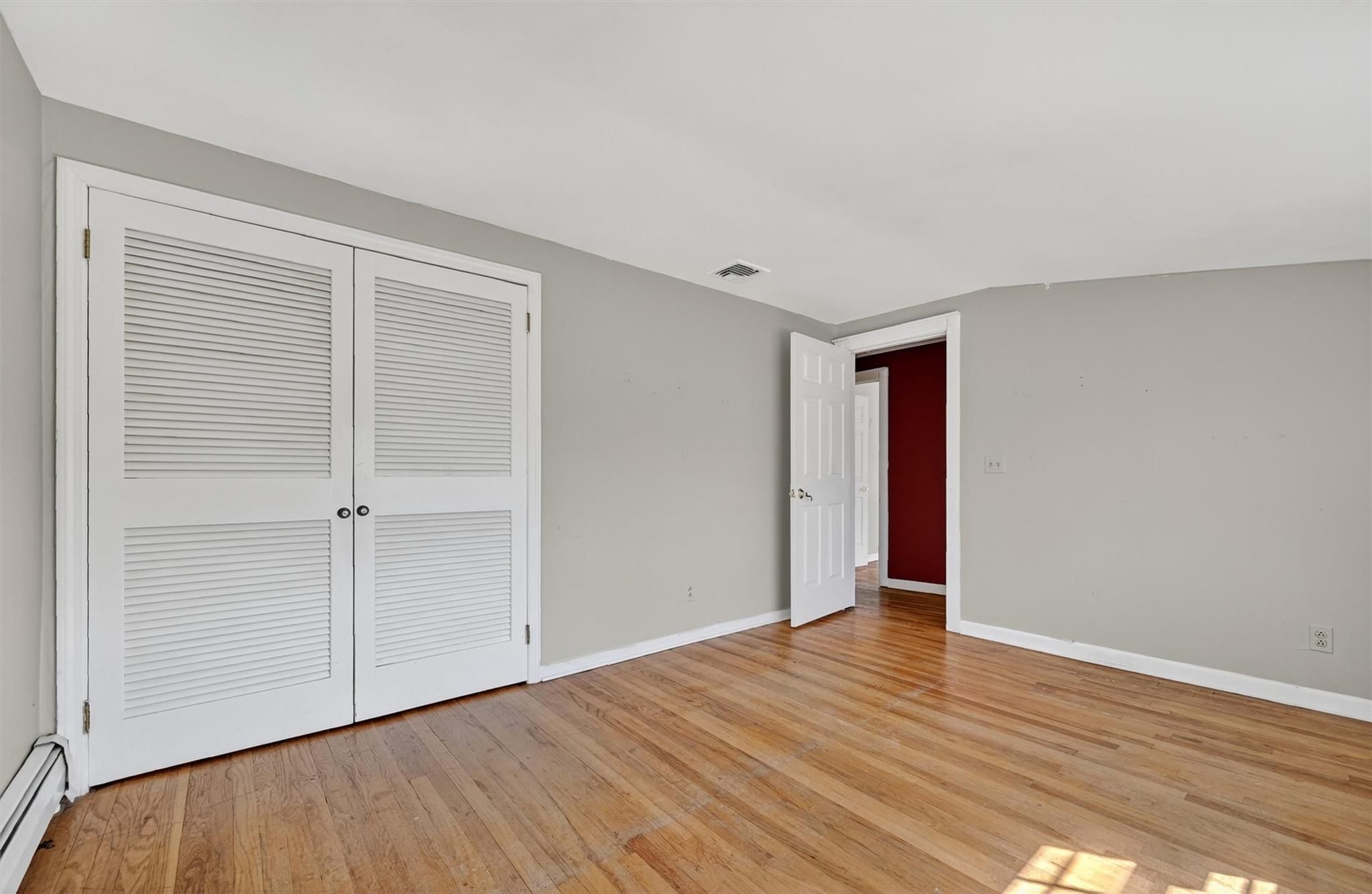 151 Tuthill Road Blooming Grove, NY 10914 - Photo 26 of 49 a view of an empty room with wooden floor