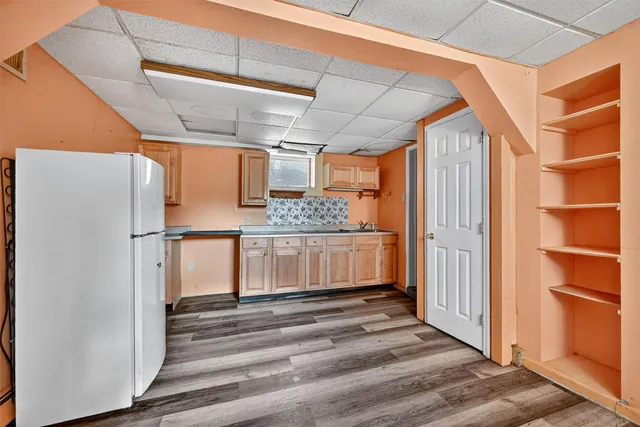 a view of balcony with wooden floor and fence