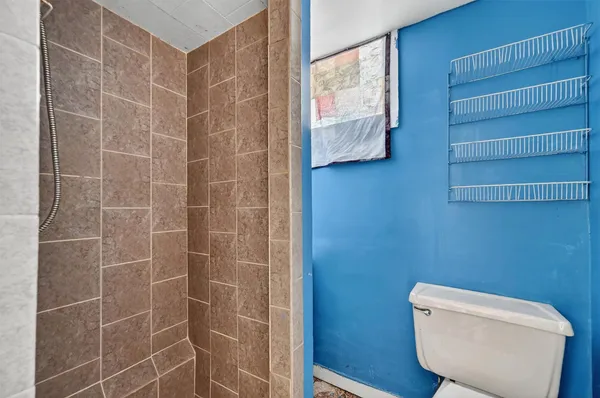 a front view of a house with a yard and a garage