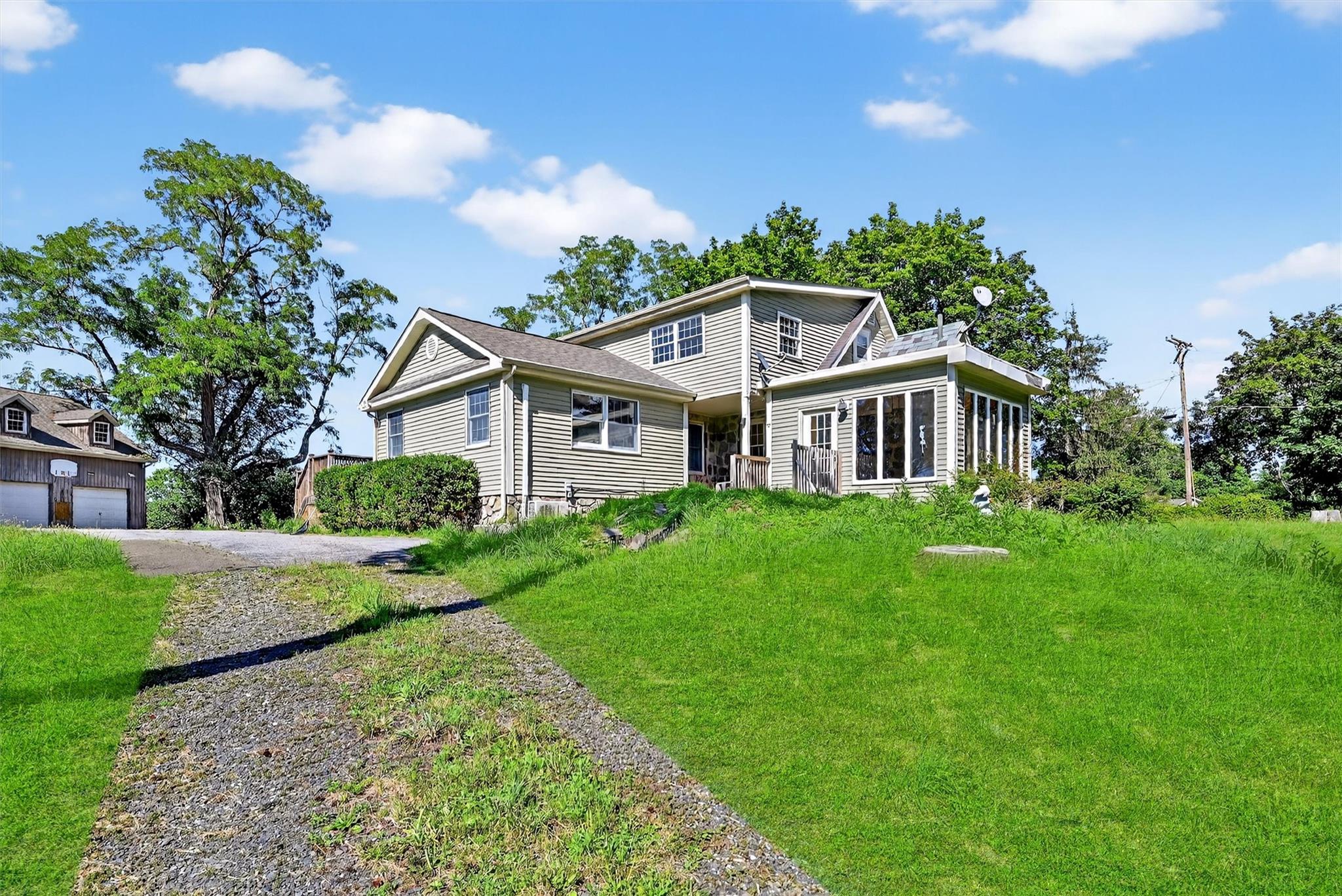 151 Tuthill Road Blooming Grove, NY 10914 - Photo 36 of 49 a front view of a house with a yard