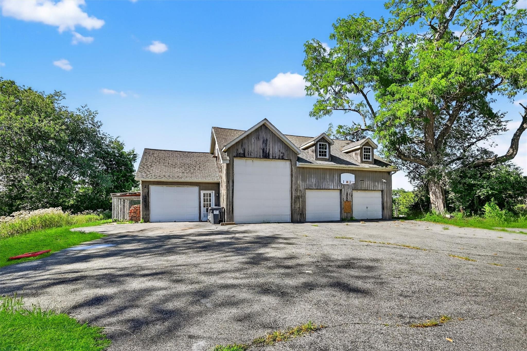 151 Tuthill Road Blooming Grove, NY 10914 - Photo 41 of 49 a front view of a house with a yard and garage