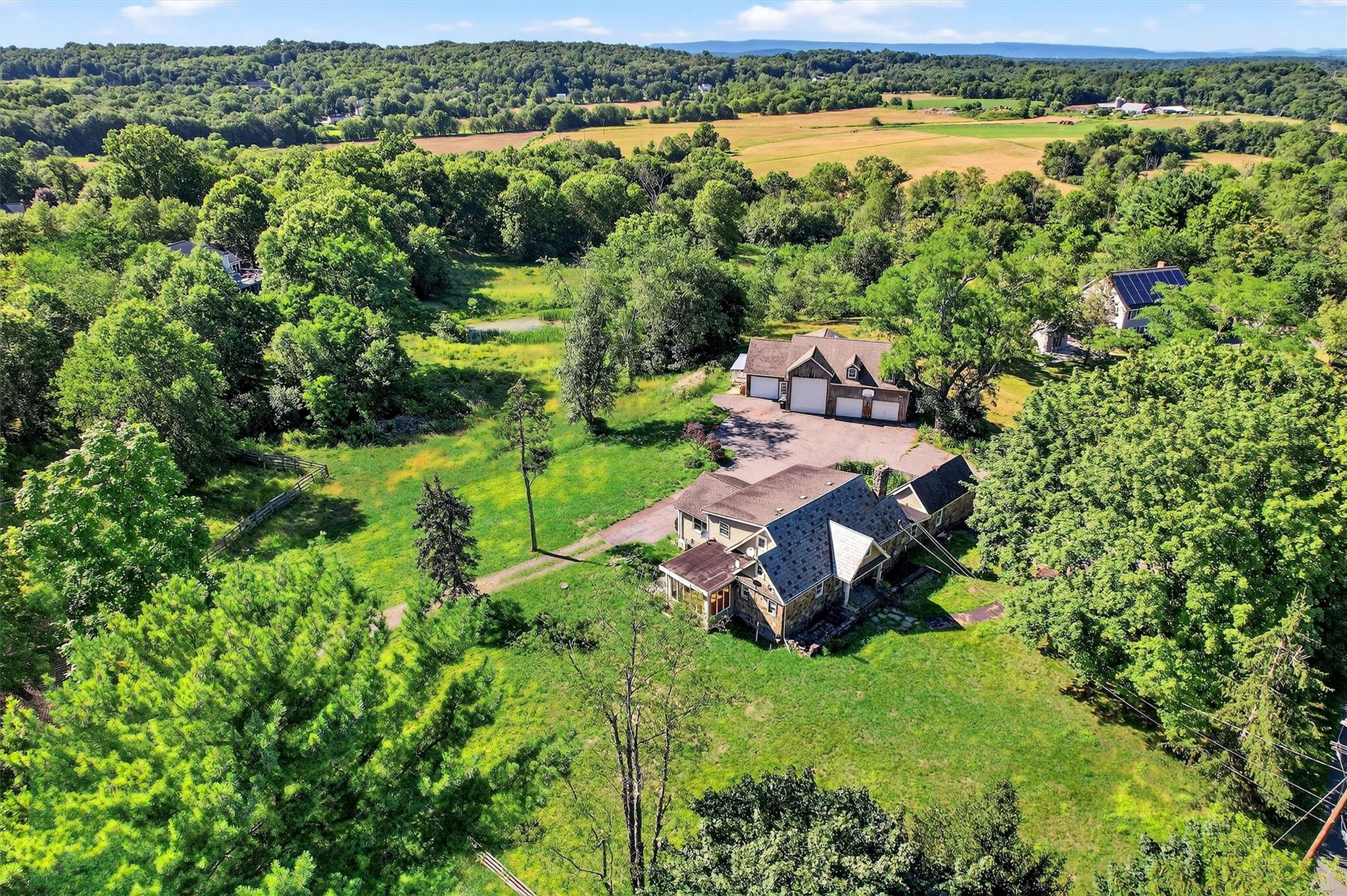 151 Tuthill Road Blooming Grove, NY 10914 - Photo 45 of 49 an aerial view of a house with a yard and lake view