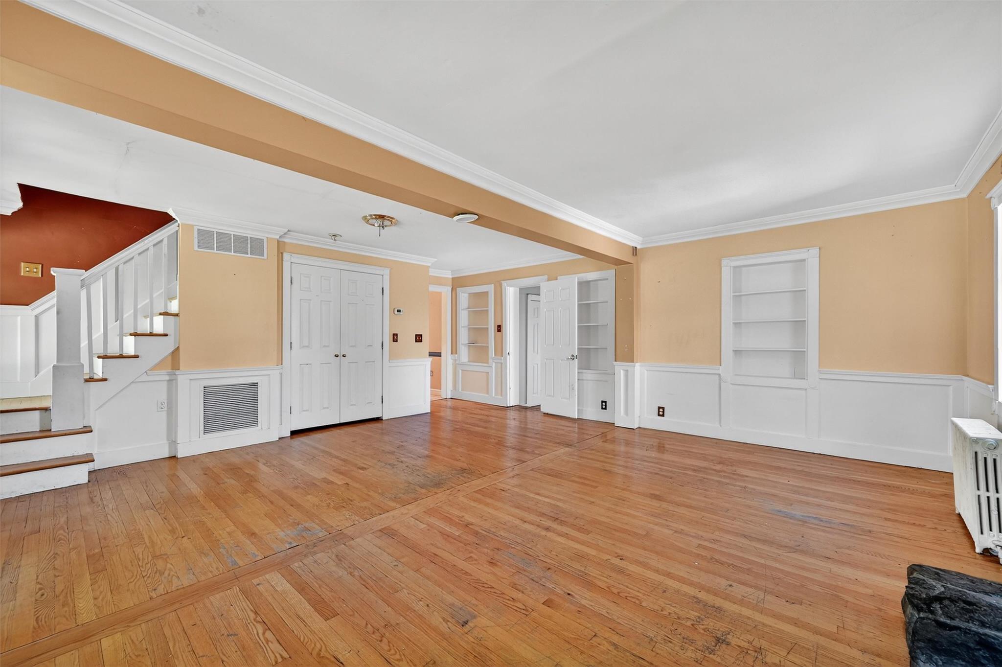 151 Tuthill Road Blooming Grove, NY 10914 - Photo 9 of 49 a view of an empty room with wooden floor and a window