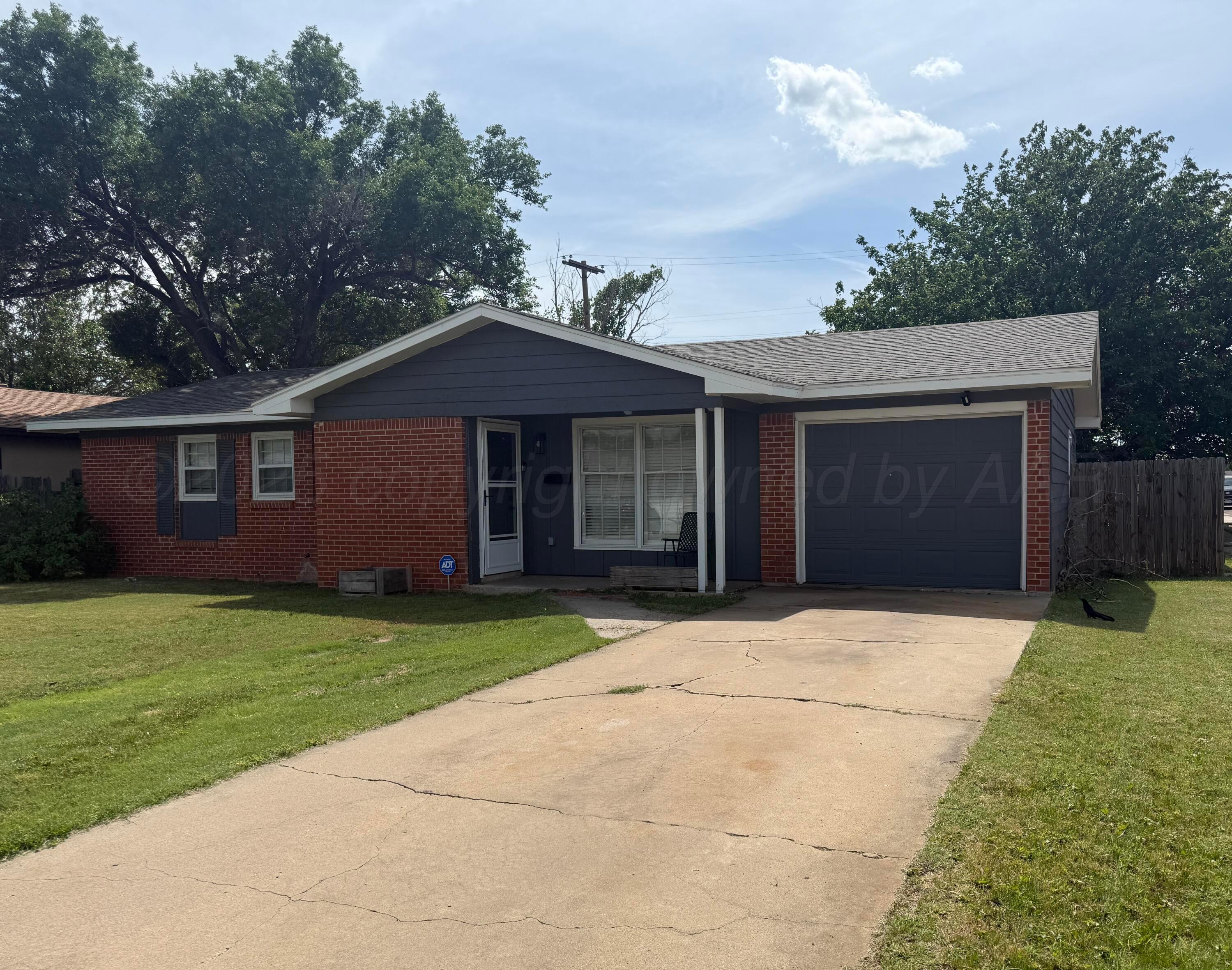4600 South Bryan Street Amarillo, TX 79110 - Photo 1 of 13 a front view of a house with garden