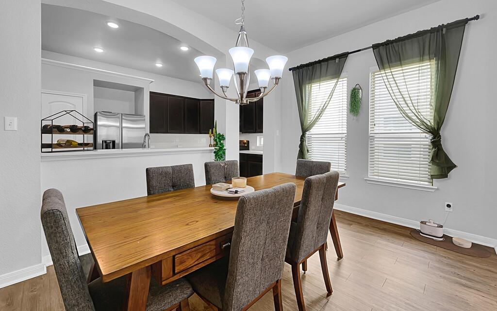 2720 Beutel Road Lorena, TX 76655 - Photo 14 of 37 Dining space featuring light wood finished floors, a chandelier, and recessed lighting
