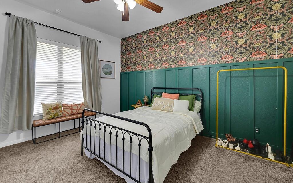 2720 Beutel Road Lorena, TX 76655 - Photo 16 of 37 Bedroom featuring wallpapered walls, carpet floors, wainscoting, and ceiling fan