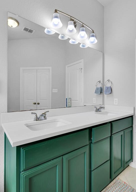 2720 Beutel Road Lorena, TX 76655 - Photo 19 of 37 Bathroom featuring double vanity and light tile patterned floors