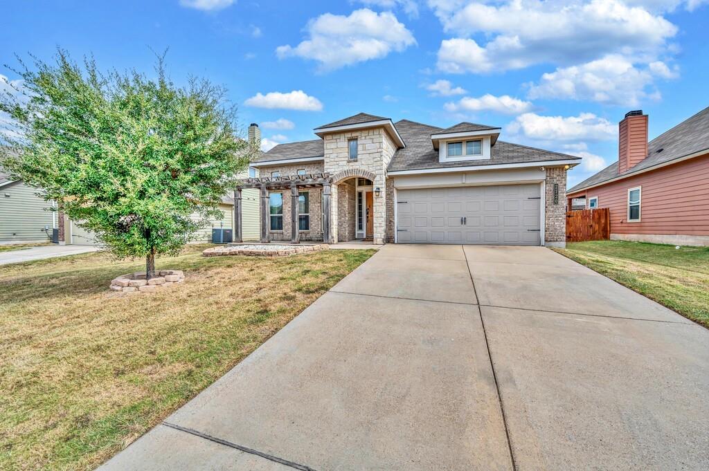 2720 Beutel Road Lorena, TX 76655 - Photo 2 of 37 French provincial home featuring concrete driveway, stone siding, brick siding, and an attached garage