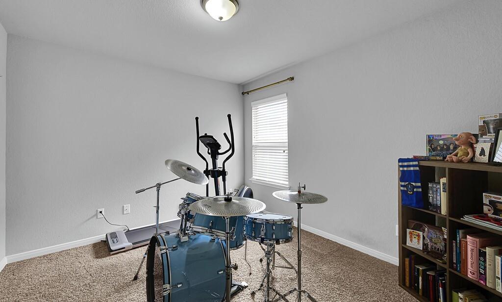 2720 Beutel Road Lorena, TX 76655 - Photo 31 of 37 Exercise room with carpet and a textured wall
