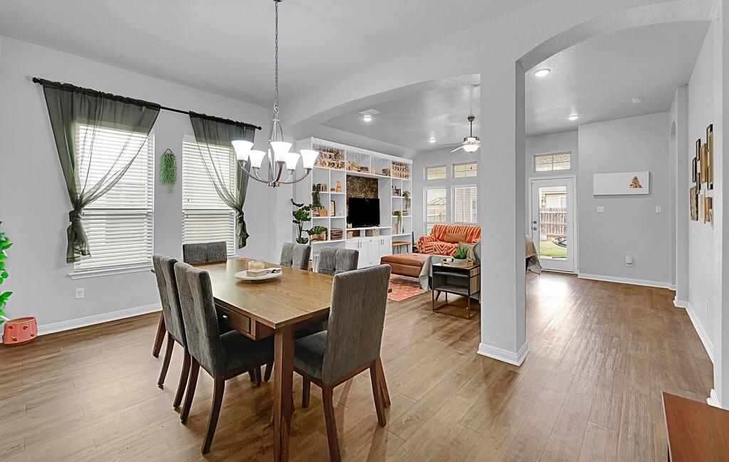 2720 Beutel Road Lorena, TX 76655 - Photo 6 of 37 Dining space featuring arched walkways, ceiling fan, wood finished floors, and recessed lighting