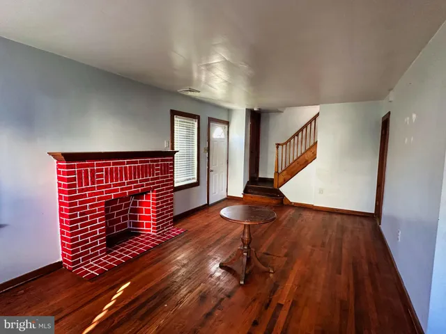 a view of an entryway with wooden floor