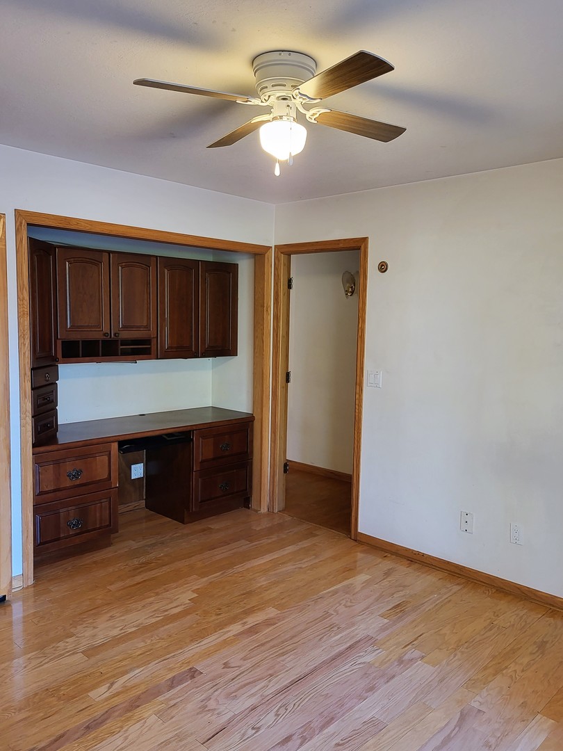 10120 East Hickory Ridge Drive Rochelle, IL 61068 - Photo 12 of 39 a view of cabinets and wooden floor