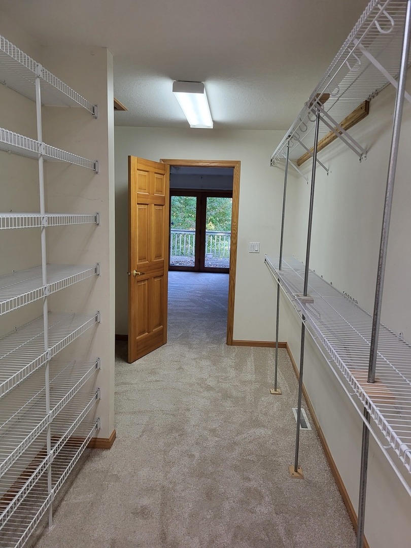 10120 East Hickory Ridge Drive Rochelle, IL 61068 - Photo 18 of 39 a view of an empty room with a staircase